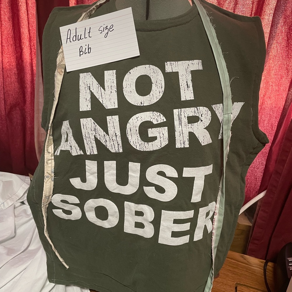 Green Adult Size Bib with White Text not angry just sober